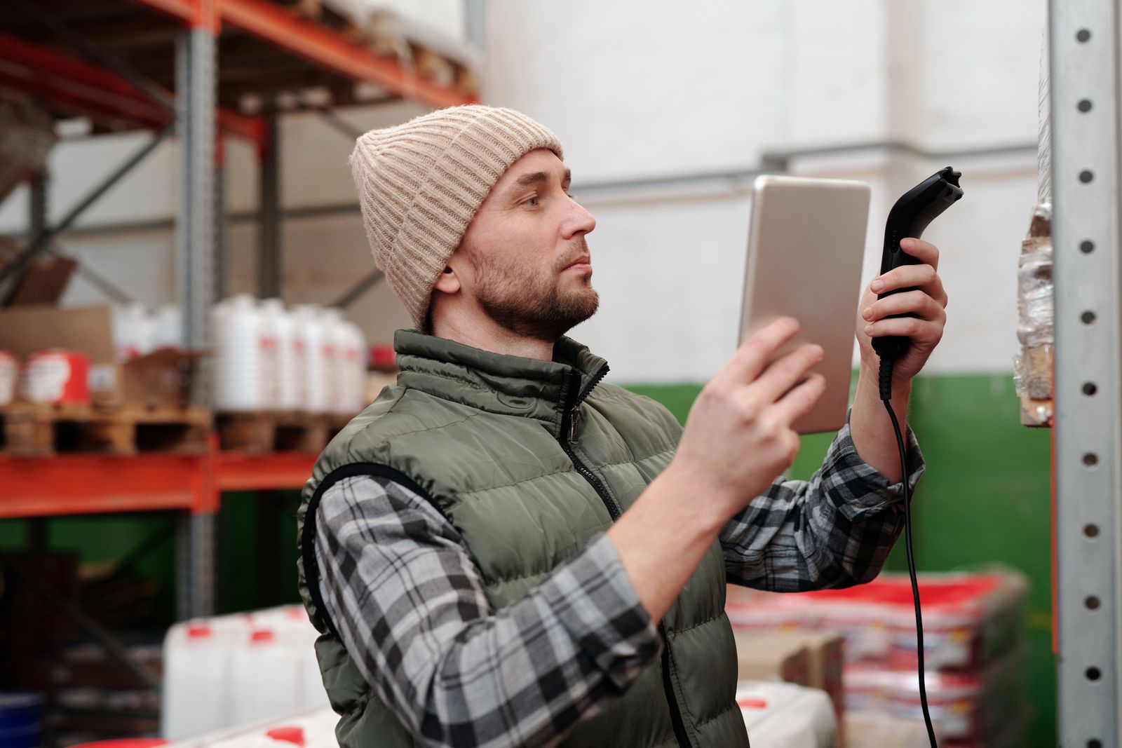 Warehouse operator managing inventory on a tablet